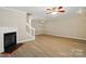 Open living space with a fireplace, modern floors, and ample natural light at 110 Rhett Ct, Fort Mill, SC 29715