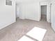 Bright bedroom with two doorways and neutral carpet, ready for personalization at 1121 Swearngan Ridge Ct, Charlotte, NC 28216