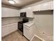 Well-lit kitchen with modern appliances and white cabinets at 1121 Swearngan Ridge Ct, Charlotte, NC 28216