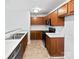 Efficient kitchen space featuring wood cabinets and updated appliances at 1121 Swearngan Ridge Ct, Charlotte, NC 28216