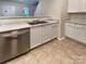 Stainless steel dishwasher and sink with white cabinets in the kitchen at 1121 Swearngan Ridge Ct, Charlotte, NC 28216