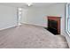 Spacious living room featuring a fireplace with classic wooden mantle at 1121 Swearngan Ridge Ct, Charlotte, NC 28216