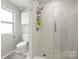 Clean bathroom showcases a glass-enclosed shower with white subway tile and modern fixtures at 1133 Metropolitan Ave # 318, Charlotte, NC 28204