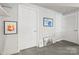 Bright hallway with modern art pieces enhancing its charm at 1133 Metropolitan Ave # 318, Charlotte, NC 28204