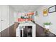 Bright, open concept living space with dining area, stainless appliances, and hardwood floors at 1133 Metropolitan Ave # 318, Charlotte, NC 28204