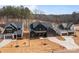 Aerial view of new construction neighborhood featuring two-story homes with private yards at 123 Mills Garden Rd, Statesville, NC 28625
