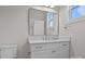 A sleek bathroom featuring a modern vanity, marble countertop, and a toilet providing a clean and minimalist design at 123 Mills Garden Rd, Statesville, NC 28625