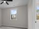 Bright bedroom featuring a large window, neutral walls and plush carpeting for a calm and inviting feel at 123 Mills Garden Rd, Statesville, NC 28625