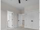 Spacious bedroom with multiple doorways, neutral walls and plush carpet creating a flexible space at 123 Mills Garden Rd, Statesville, NC 28625
