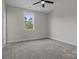 Bedroom with carpet flooring and a large window with outdoor views at 123 Mills Garden Rd, Statesville, NC 28625