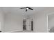 Bright bedroom featuring a fan, walk-in closet and bathroom access creating a suite-like atmosphere at 123 Mills Garden Rd, Statesville, NC 28625