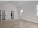Bedroom featuring hard wood floors, stylish lighting, and a view to the bathroom at 123 Mills Garden Rd, Statesville, NC 28625