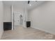 Bedroom featuring wood look floors and black built in storage with staircase view at 123 Mills Garden Rd, Statesville, NC 28625