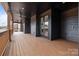 Spacious covered patio with wood ceilings, wood railings, and an exterior ceiling fan at 123 Mills Garden Rd, Statesville, NC 28625