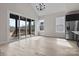 Open dining area bathed in light with sliding glass doors to the outside and a modern chandelier at 123 Mills Garden Rd, Statesville, NC 28625
