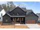 Charming two-story home featuring a modern design, a covered porch, and an attached two-car garage at 123 Mills Garden Rd, Statesville, NC 28625