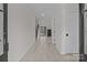 Bright and airy foyer featuring light hardwood floors, neutral walls, and views of the staircase and living spaces at 123 Mills Garden Rd, Statesville, NC 28625