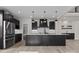 Stylish kitchen boasts a large island, modern lighting, stainless steel appliances, and ample storage at 123 Mills Garden Rd, Statesville, NC 28625