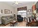 Comfortable living room with hardwood floors, a piano, and plenty of seating at 123 Wheatridge Dr, Statesville, NC 28625