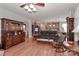 Open-concept living room showcasing wood floors, a classic hutch, and seamless flow to the adjacent kitchen at 123 Wheatridge Dr, Statesville, NC 28625