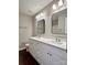Bright bathroom with a double sink vanity and stylish mirrors at 12403 Panthersville Dr, Charlotte, NC 28269