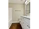 Bathroom showcasing a bright vanity with a mirror and a shower at 12403 Panthersville Dr, Charlotte, NC 28269