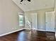 Bright bedroom with vaulted ceiling, window and wood-look flooring at 12403 Panthersville Dr, Charlotte, NC 28269
