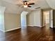 Spacious bedroom featuring wood flooring, ceiling fan and closet at 12403 Panthersville Dr, Charlotte, NC 28269