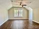 Upstairs bedroom features wood flooring and ceiling fan at 12403 Panthersville Dr, Charlotte, NC 28269