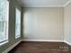 Bedroom featuring a windows bringing in natural light and dark hardwood flooring at 12403 Panthersville Dr, Charlotte, NC 28269