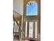 Bright foyer featuring a large arched window, complemented by a stylish chandelier at 12403 Panthersville Dr, Charlotte, NC 28269