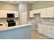 Well-lit kitchen offering modern appliances, white cabinetry, and quartz countertops at 12403 Panthersville Dr, Charlotte, NC 28269