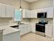 Bright kitchen featuring ample counter space, stainless steel appliances, and plenty of storage at 12403 Panthersville Dr, Charlotte, NC 28269