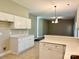 Open concept kitchen featuring stone countertops and seamless access to the living room at 12403 Panthersville Dr, Charlotte, NC 28269