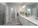 Light and bright bathroom with a double sink vanity and decorated with modern fixtures and decorative items at 126 W Morehouse Ave, Mooresville, NC 28117