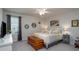 Comfortable bedroom with soft lighting, neutral walls, and a cozy bed with decorative pillows at 126 W Morehouse Ave, Mooresville, NC 28117