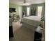 Spacious bedroom with large windows, plush carpet, and neutral-toned decor at 126 W Morehouse Ave, Mooresville, NC 28117