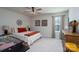 Inviting bedroom with an orange accent color, a comfortable bed, and natural light from the window at 126 W Morehouse Ave, Mooresville, NC 28117