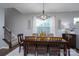 Warm dining room featuring a large wooden table with seating for six at 126 W Morehouse Ave, Mooresville, NC 28117