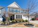Charming two-story home with gray siding, blue shutters, and a well-maintained front yard at 126 W Morehouse Ave, Mooresville, NC 28117