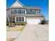 Charming two-story home with gray siding, blue shutters, and a well-maintained front yard at 126 W Morehouse Ave, Mooresville, NC 28117