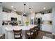 Bright, modern kitchen with a large island, stainless steel appliances, and ample counter space at 126 W Morehouse Ave, Mooresville, NC 28117