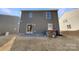 Backyard area with a stone patio, grill, and grass at 1298 Bryson Ln, Denver, NC 28037