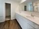 Bathroom with double sink vanity and a large mirror at 1298 Bryson Ln, Denver, NC 28037