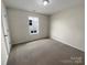 Bright bedroom featuring neutral walls and soft carpeting at 1298 Bryson Ln, Denver, NC 28037