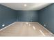 A spacious bedroom showcasing blue accent walls and plush carpeting at 1298 Bryson Ln, Denver, NC 28037