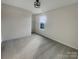 Bedroom with plush carpeting, neutral walls and natural light at 1298 Bryson Ln, Denver, NC 28037