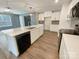 Modern kitchen with white cabinets, stainless steel appliances, and an open-concept layout at 1298 Bryson Ln, Denver, NC 28037