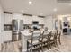 Spacious kitchen featuring stainless steel appliances, shaker cabinets, and a large kitchen island at 147 Mountain Bridge Way, Statesville, NC 28625