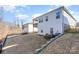 Spacious backyard with a black metal fence and a gentle slope, perfect for outdoor activities at 14707 Batteliere Dr, Charlotte, NC 28278